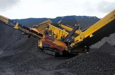 Tracked crusher on a stockpile
