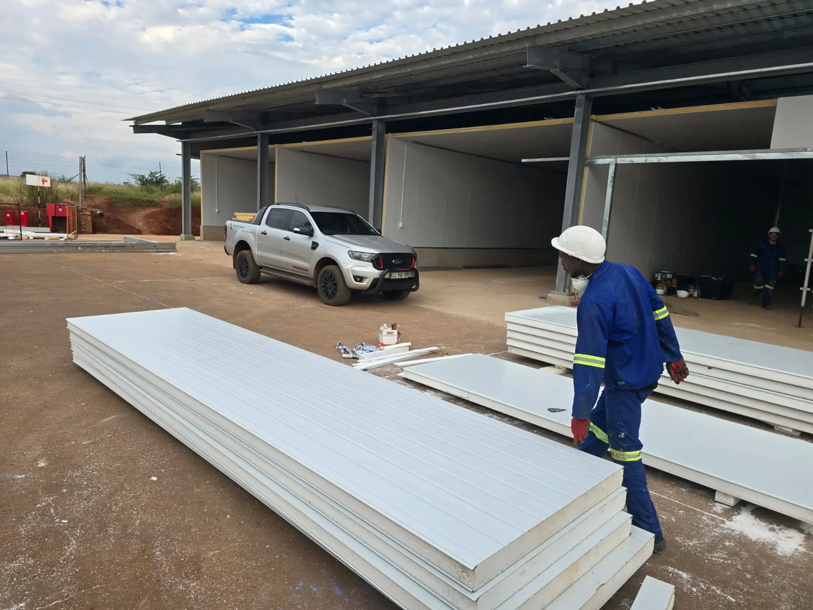 Iso panels being installed under the steel roof